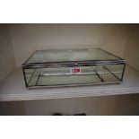 A small mirrored glass display case, 30cm wide.