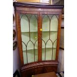 A reproduction mahogany concave standing corner cupboard, 91.5cm wide.