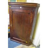 A George III oak and walnut crossbanded hanging corner cupboard,Êthe interior with secret