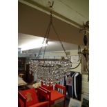 A small three tier chandelier;Êtogether with a brass three branch ceiling light.