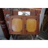 An Edwardian mahogany hanging cupboard, 43cm wide.