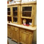 An antique pine dresser and rack, 180cm wide.