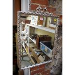 A silvered wood framed wall mirror, 72 x 50cm.