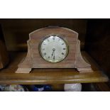 A 1920s mahogany mantel timepiece, 28cm wide.