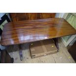 A reproduction mahogany low occasional table, 106cm wide.