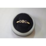 Two 18ct gold diamond rings; together with another sapphire and diamond example.