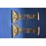 A pair of Victorian Corithinian column silver candlesticks, by Martin, Hall & Co Ltd, London 1889,