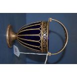 A silver swing handled basket, by T M & Co, Birmingham 1924, having blue glass liner, 10cm, 138g