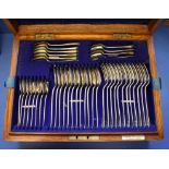 An Edwardian oak canteen of silver Old English rat tail  flatware, by Elkington & Co, Birmingham