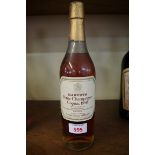 A 24 fl.oz. bottle of Harvey's 1950 Petite Champagne Cognac, landed 1964, bottled 1975.