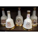 Five various Bell's decanters, comprising: a 75cl 1986 Queen's 60th Birthday; a 75cl 1986 Marriage