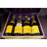 Four 20cl bottles of Veuve Clicquot NV champagne, in card box.