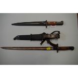 Three various bayonets, two with scabbards.