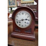 Four various mantel clocks.