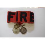 A World War I War Medal, to E M Jenkins, VAD;  together with a 'Fire' armband; and a Victoria Golden