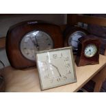 Four various timepieces, to include a brass easel back example.