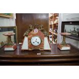 An Art Deco marble, onyx and gilt metal clock garniture, the clock 26cm high.