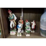 Six Continental porcelain Napoleonic soldiers, largest 31cm high.