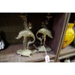 A pair of brass crane and tortoise figural candlesticks, 28cm high.