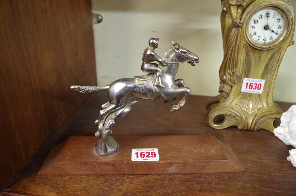 Automobilia: a vintage racehorse and jockey car mascot, by Desmo, 13cm high, on associated wood