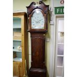 A George III oak mahogany and inlaid eight day longcase clock, the 13in arched painted dial
