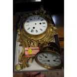 A French gilt bronze rococo cartel clock case, with circular enamel dial; together with another