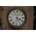 An oak single fusee wall clock, the 11in painted circular dial, inscribed 'John Walker 1 South