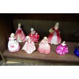 Seven Royal Doulton figures, comprising 'Janet', HN1537; 'Debbie', HN2400; 'Goody Two Shoes',