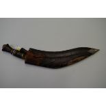 An old Kukri and leather sheaf.