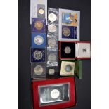 A small collection of coins, to include a US silver proof dollar.