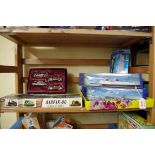 Three Hornby Minic Ships, boxed; together with four model battleships, unboxed; an Airfix train kit;