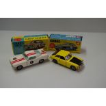 A Corgi Toys 'New MGC GT', (with suitcase), No.345; together with Ford Mustang Fastback 2+2