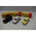 Three Dinky Toys, comprising: Vauxhall Viva, No.136; Vauxhall Victor Estate, No.141; Austin Taxi,