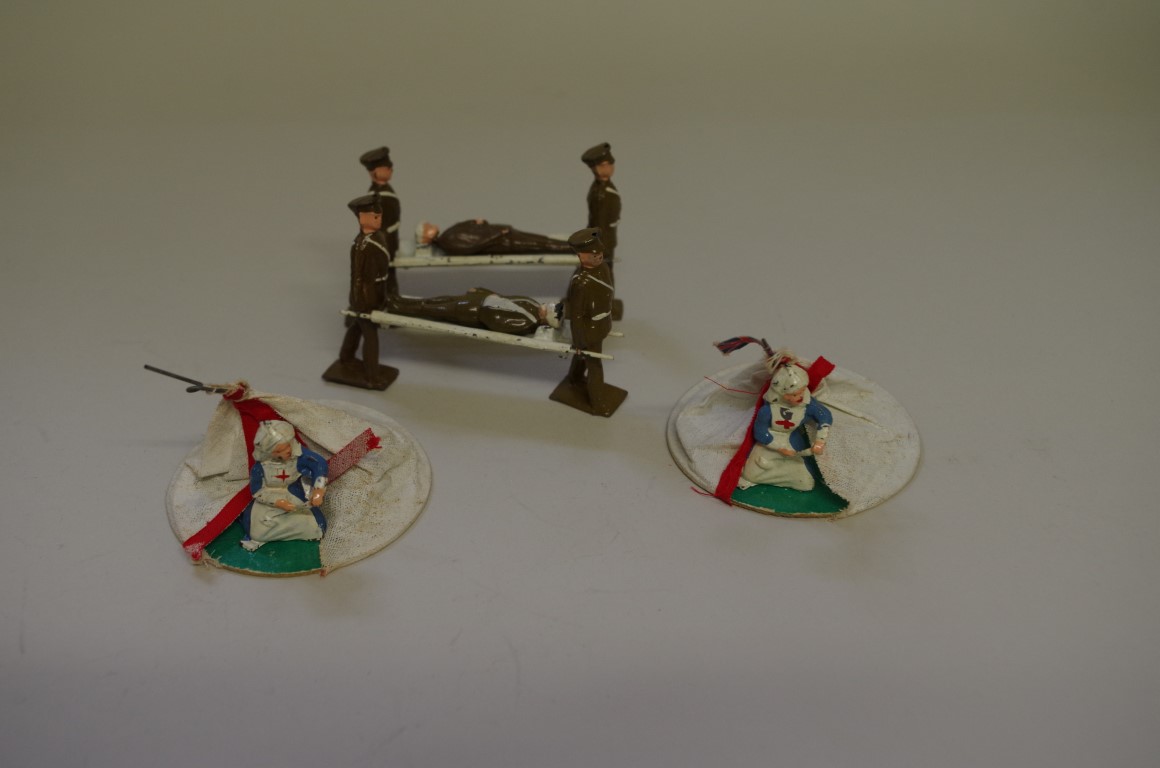 A Crescent Toys ARP First Aid Post No.695, comprising stretcher bearers, nurses, tents and patients,