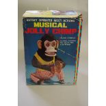 A vintage 'Made in Japan' musical Jolly Chimp, boxed.