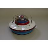 A vintage tinplate 'Space Patrol 3' flying saucer.