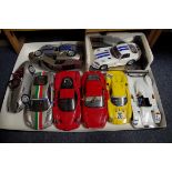 Nine unboxed 1/18 scale metal model racing cars, with examples by Burago, Hot Wheels, Maisto,