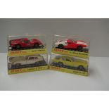 Four Dinky Toys in perspex cases; comprising: Dino Ferrari, No.216; Jaguar E Type, No.131; De