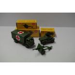 Three Dinky Toys boxed military vehicles, comprising: Military Ambulance, No.26; 25 Pounder Field