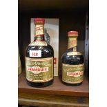 Two old bottles of Drambuie, probably 1960s bottlings, comprising: a bottle, in card box and with