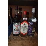 A 1 litre bottle of Wood's Old Navy rum; together with a 1 litre bottle of Gilbey's gin; and a 1