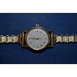 An Omega 9ct gold ladies wristwatch with leather strap; together with another ladies 9ct gold