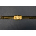 A vintage 1940s 14k gold Jaegar LeCoultre tank wristwatch, having bi-coloured and subsidiary seconds