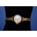 A vintage 18ct gold cased Tudor ladies manual winding wristwatch, on replacement expanding