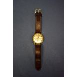 A vintage Omega gold plated gentleman's automatic wristwatch, on leather strap.