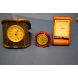 A vintage Jaeger Le Coultre leather cased travelling clock; together with another travelling clock