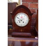 An circa 1900 mahogany and inlaid mantel clock, 37cm high.