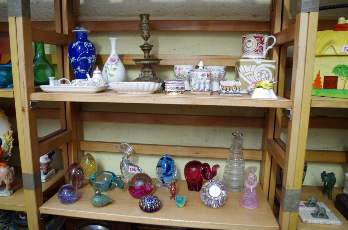 A collection of glass paperweights and similar, to include a Caithness timepiece example.