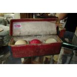 A set of three ivory billiard balls, in old card box.