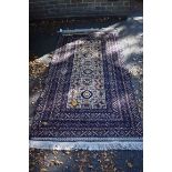 A modern Persian rug, having allover floral and geomteric design, 205 x 110cm.